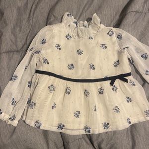 Elegant white blouse with navy blue details